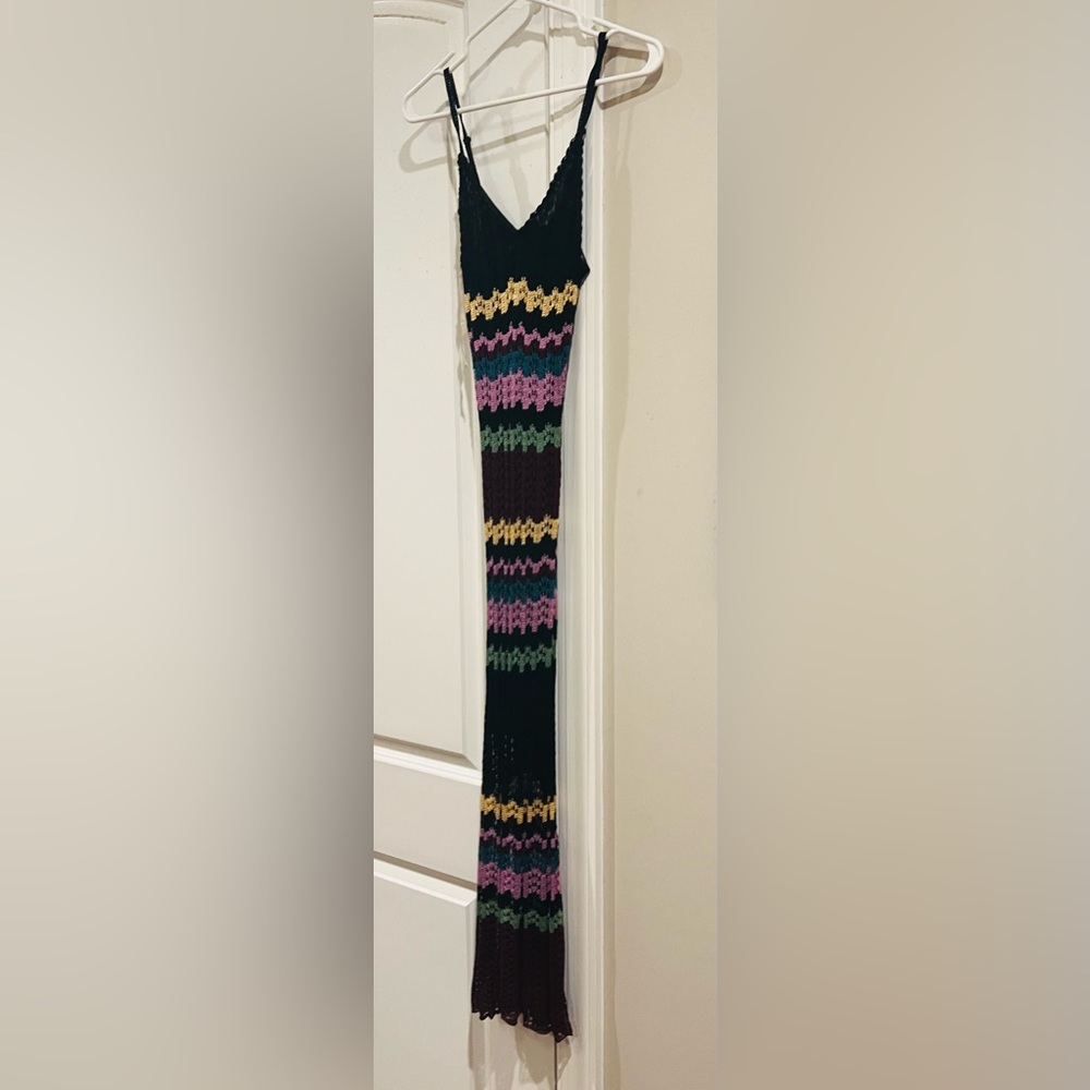 Mid length crochet style dress. Has black lining underneath. Worn maybe twice.